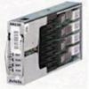 A silver rectangular object with black and white labels Description automatically generated