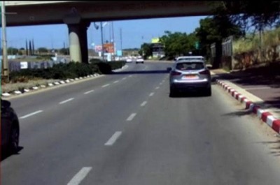 A car driving on a road
Description automatically generated