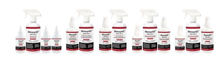 A group of white bottles with red labels
Description automatically generated