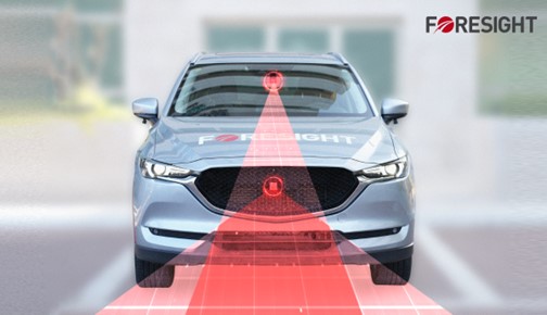 A car with a red light
Description automatically generated